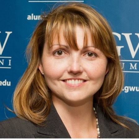 Portrait of a woman smiling.